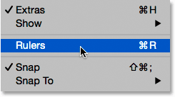 Selecting Rulers from under the View menu in Photoshop. 