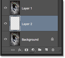 Creating a new layer below the selected layer. Image © 2016 Photoshop Essentials.com.