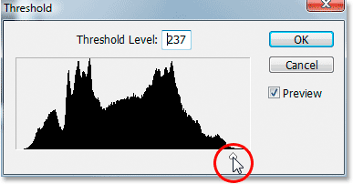 Dragging the slider at the bottom of the Threshold dialog box.